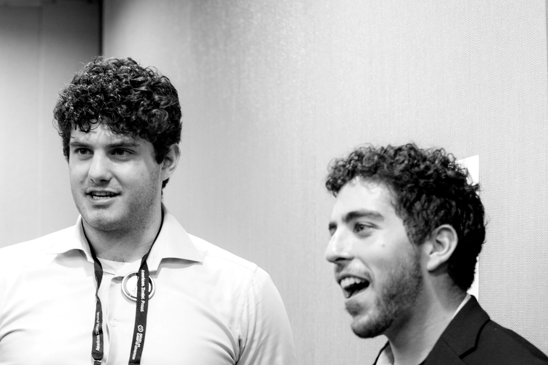 Two students in conversation at the Summit.